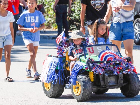 Children decorated in red, white and blue take part in the kids parade during Grimes' 175th Anniversary and Fourth of July celebration on July 4. Photo by Chris Pedigo.
