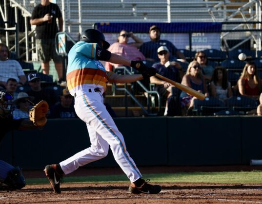 Yuba-Sutter first baseman Andrew Kirchner (18) lines a base hit on Friday, July 3 in the Freebirds win over Long Beach. Photo by Steven Bryla.