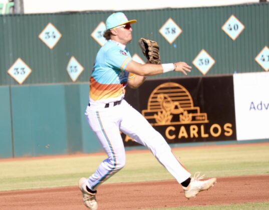 Yuba-Sutter infielder Kyle Carlson (14) throws a runner out at first on Friday, July 3 during the Freebirds&rsquo; win against Long Beach. Photo by Steven Bryla.